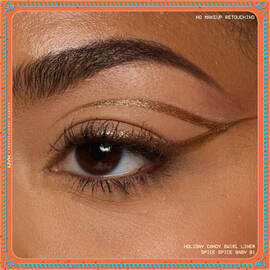 Eye close-up showcasing dramatic winged liner applied with metallic finish of NYX Professional Makeup Holiday Candy Swirl Liner in shade 01 Spice Spice Baby